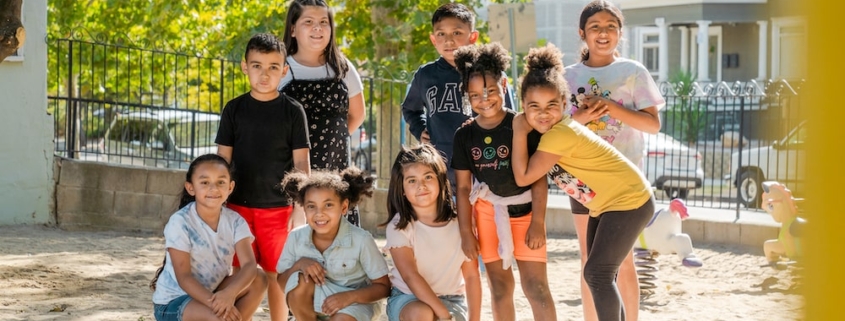 Group of kids posing outside at Kidz Can 2 Child Development Center - Fresno Location